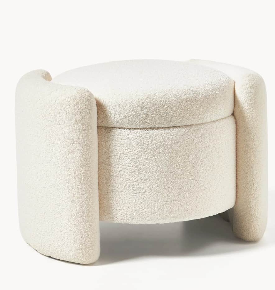 A cylindrical ottoman with a rounded top, upholstered in a textured cream-colored fabric. It feature… — 3D model