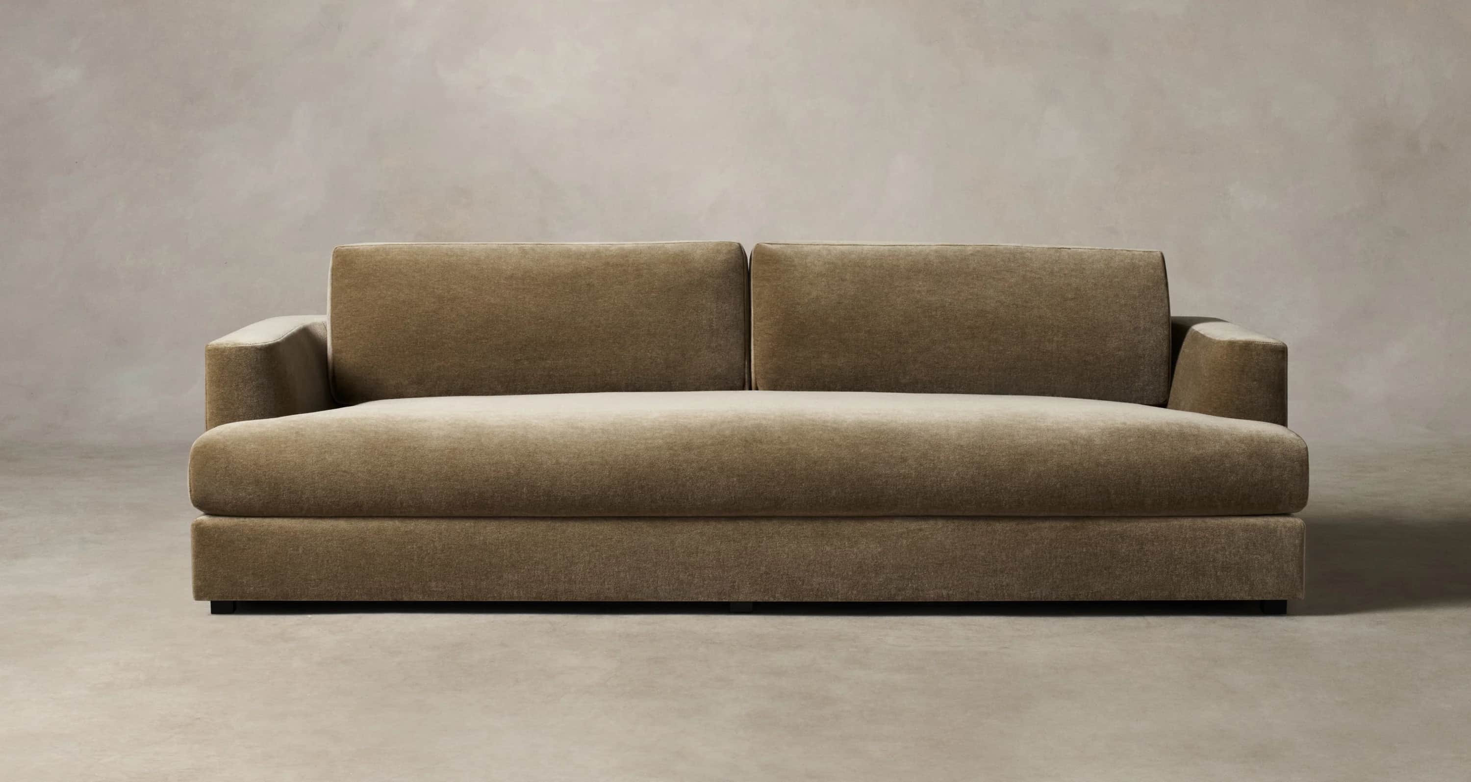 A modern, low-profile sofa with a plush upholstered finish. It features a straight silhouette with t… — 3D model
