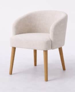A compact, modern upholstered armchair featuring a rounded backrest that seamlessly flows into integ… — 3D model