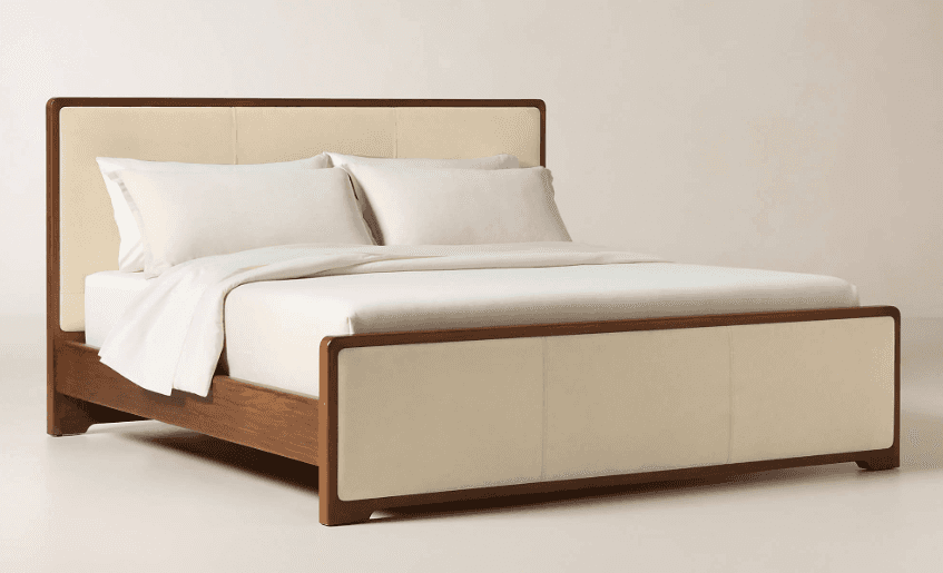 A contemporary bed frame featuring a robust wooden structure with an upholstered headboard and footb… — free BLEND 3D model