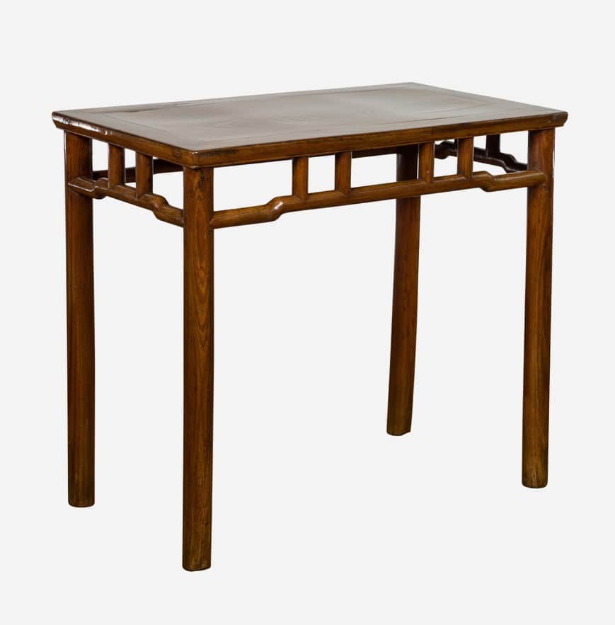 A rectangular wooden console table with four straight legs. The apron features a decorative openwork… — 3D model