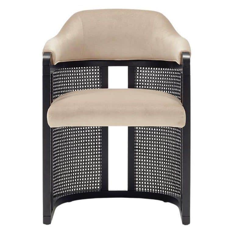 A contemporary barrel-shaped accent chair featuring a dark-stained wooden frame, natural cane detail… — 3D model