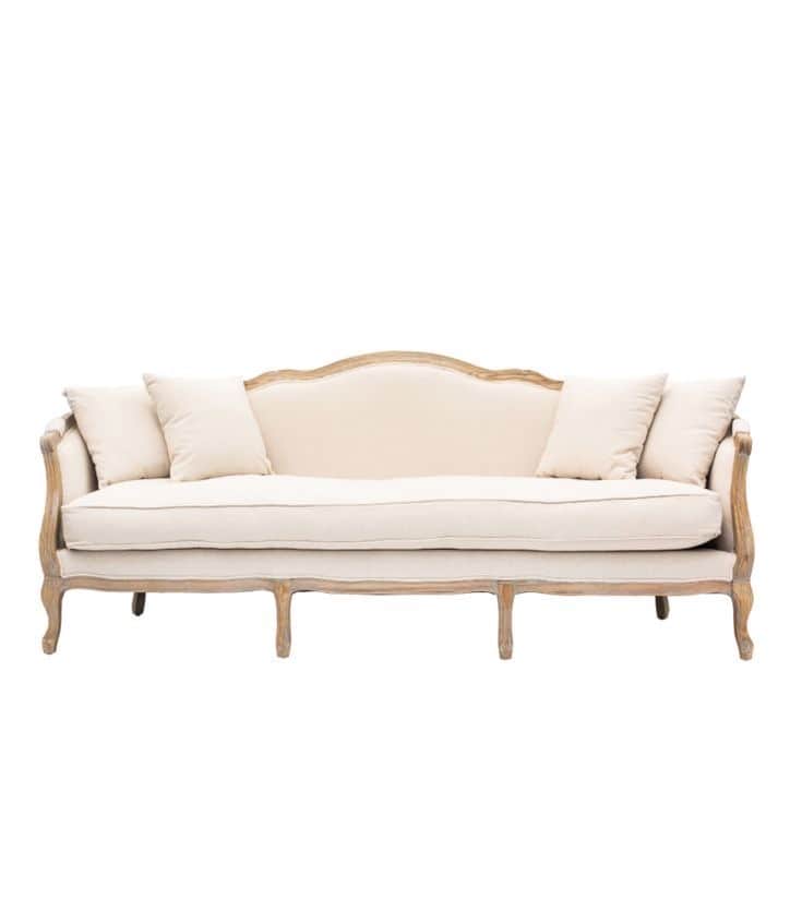 A classic French Provincial style sofa featuring an exposed, carved natural wood frame and upholster… — free GLTF 3D model