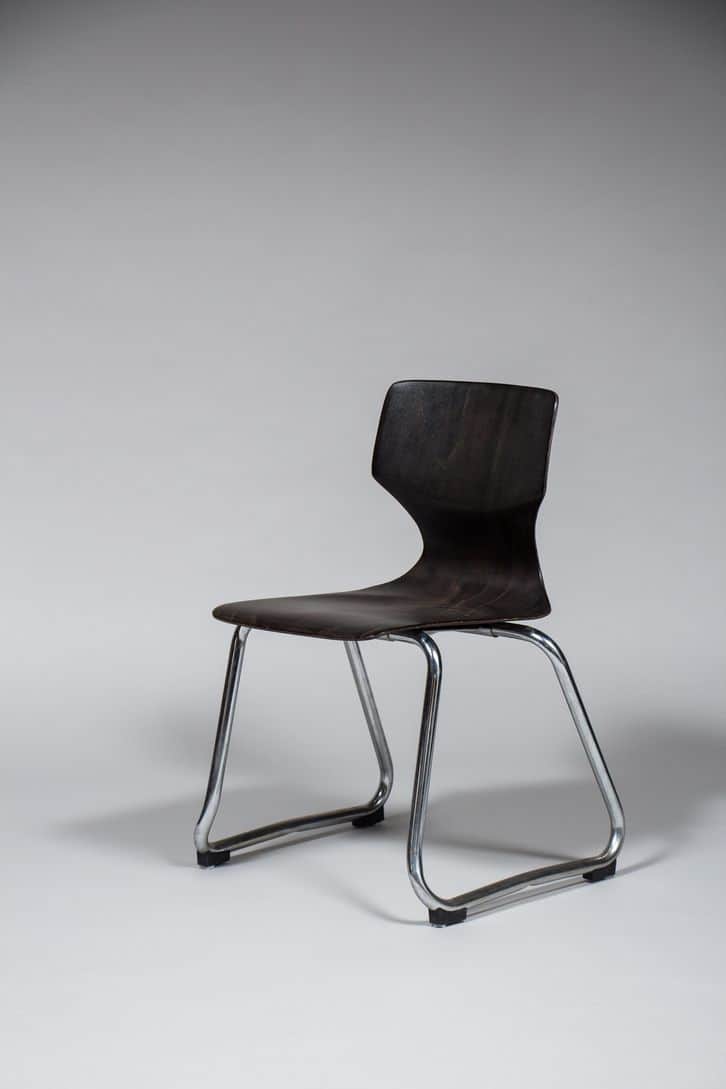 A modern chair with a molded seat and backrest, supported by a chrome-plated tubular steel frame. Th… — free GLTF 3D model