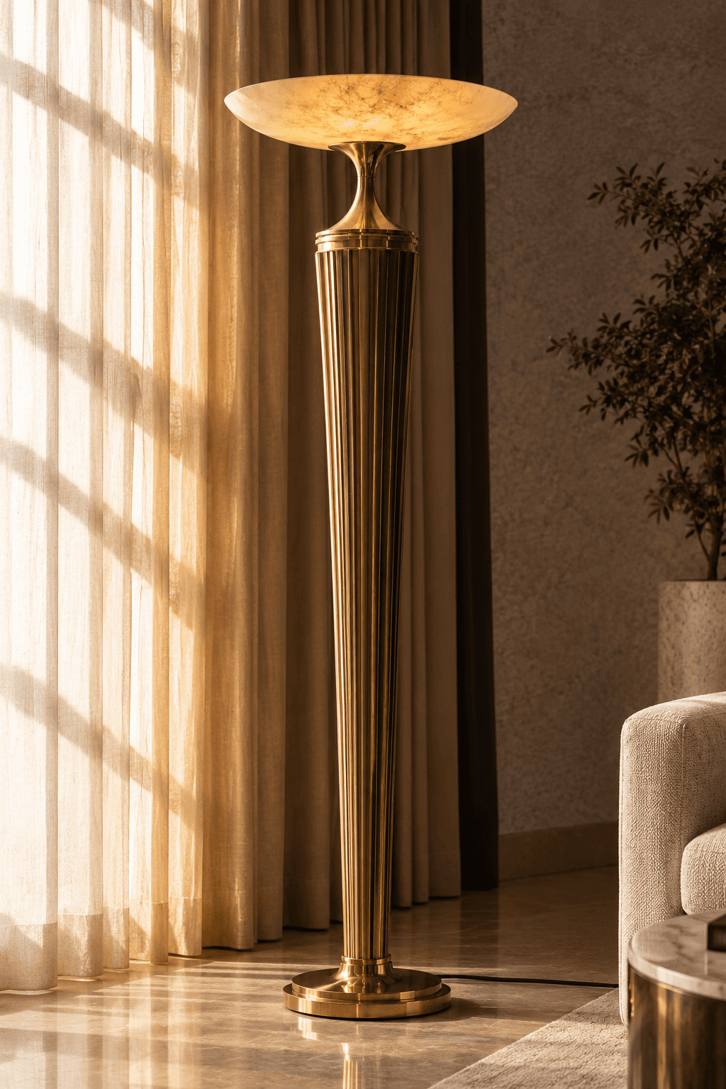 A tall, slender pedestal table featuring a fluted brass column and a shallow, dish-shaped alabaster… — 3D model