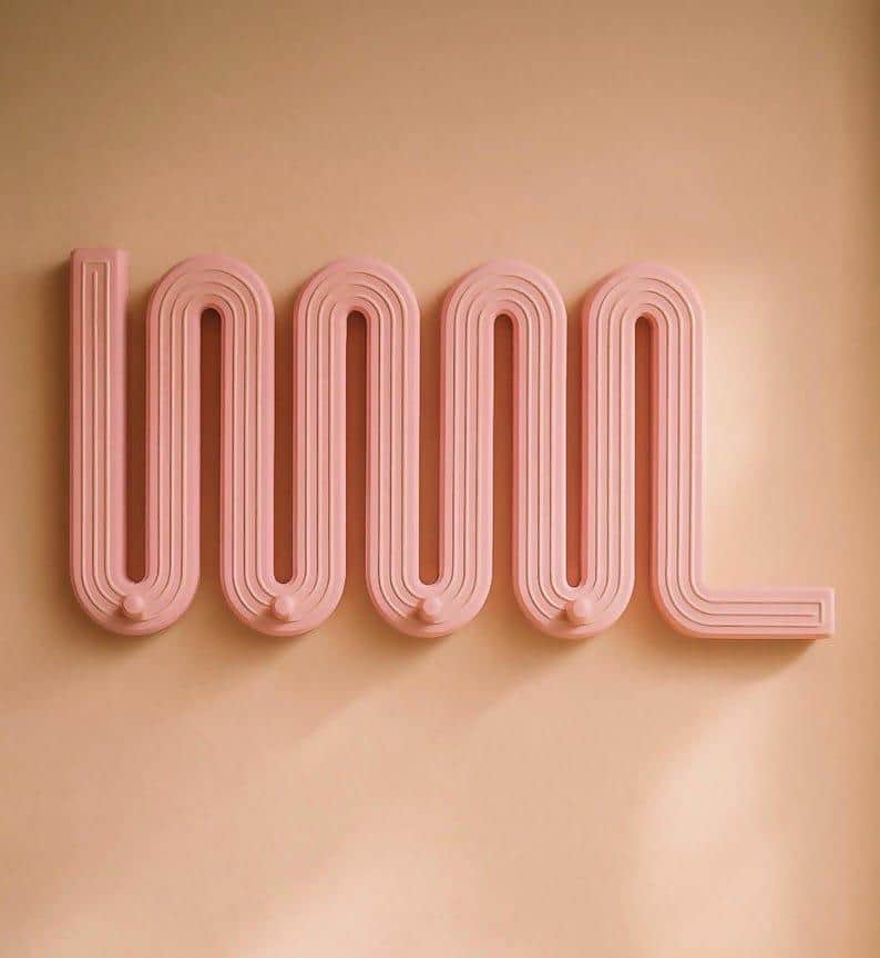 A contemporary wall-mounted coat rack featuring a distinctive wavy, zigzag design with integrated ho… — 3D model