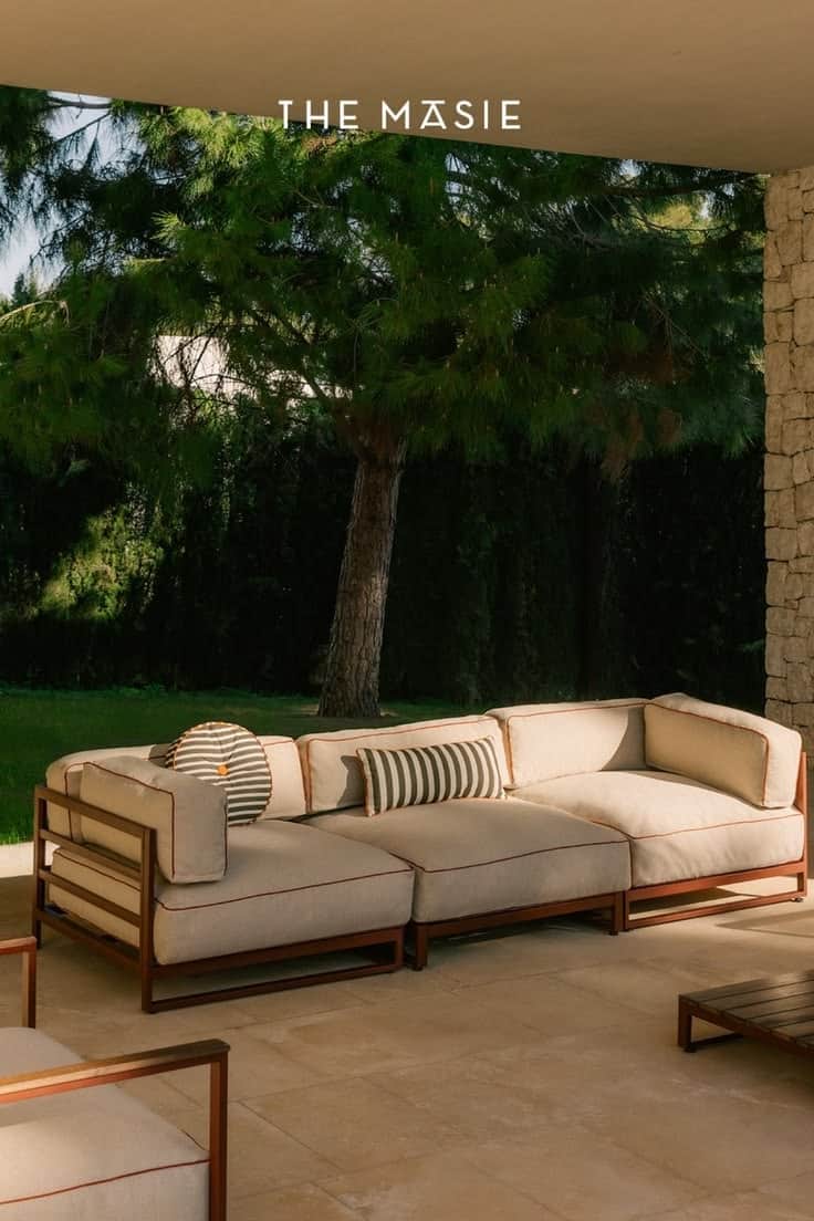 A contemporary modular outdoor sectional sofa featuring a sturdy metal frame and plush, light-colore… — 3D model