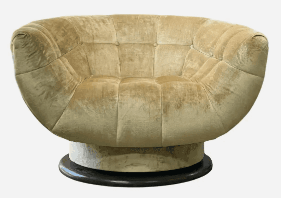 A plush, round tufted lounge chair with a swivel base, upholstered in a golden-beige velvet or cheni… — 3D model