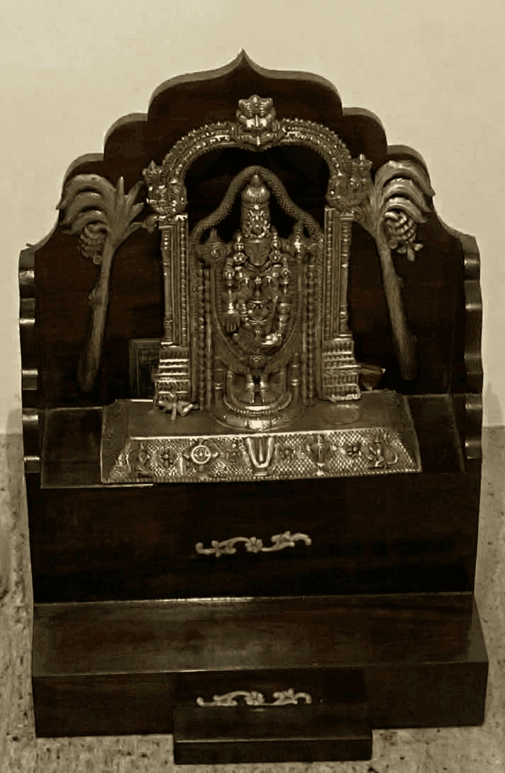 A traditional Indian pooja mandir, a small home temple crafted from dark-stained wood, featuring a d… — 3D model