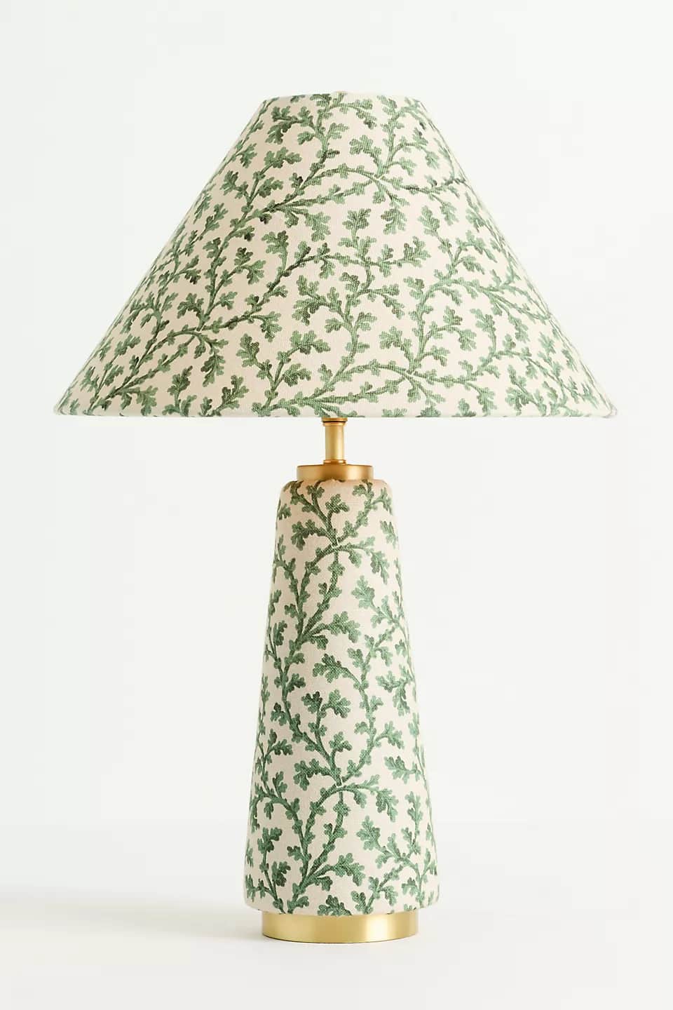 A table lamp featuring a conical lampshade and a matching conical base, both adorned with an intrica… — 3D model