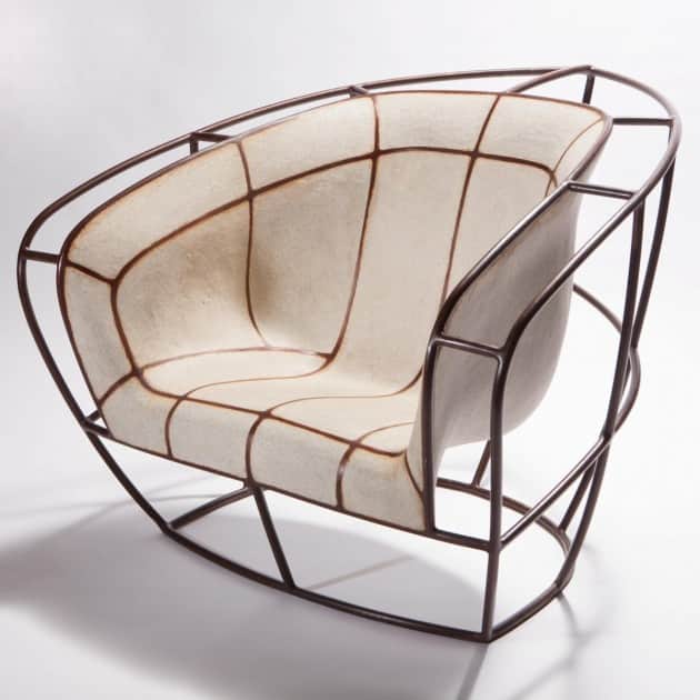 A modern armchair with a distinct curvilinear design. The chair features an external frame construct… — free OBJ 3D model