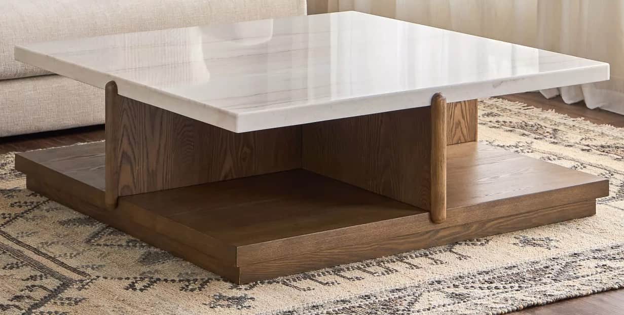 A contemporary coffee table with a square, white marble top featuring subtle grey veining. The base… — free FBX 3D model
