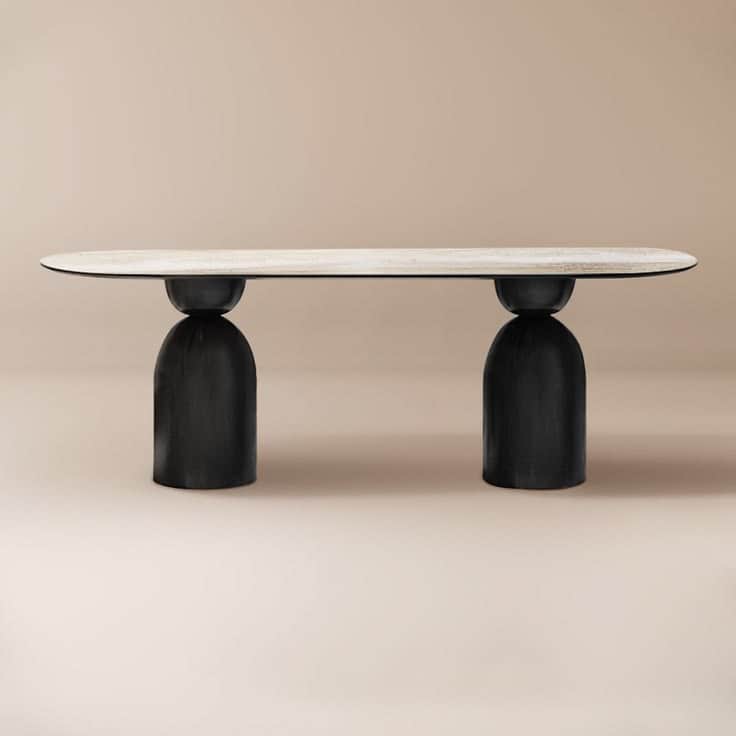 A contemporary coffee table featuring a elongated oval tabletop with a white marble-look surface, su… — 3D model