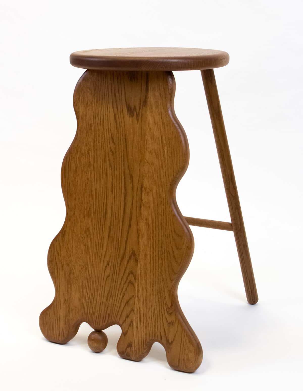 A wooden stool with a distinctive, undulating sculptural base. The seat is round and flat, made of t… — free OBJ 3D model