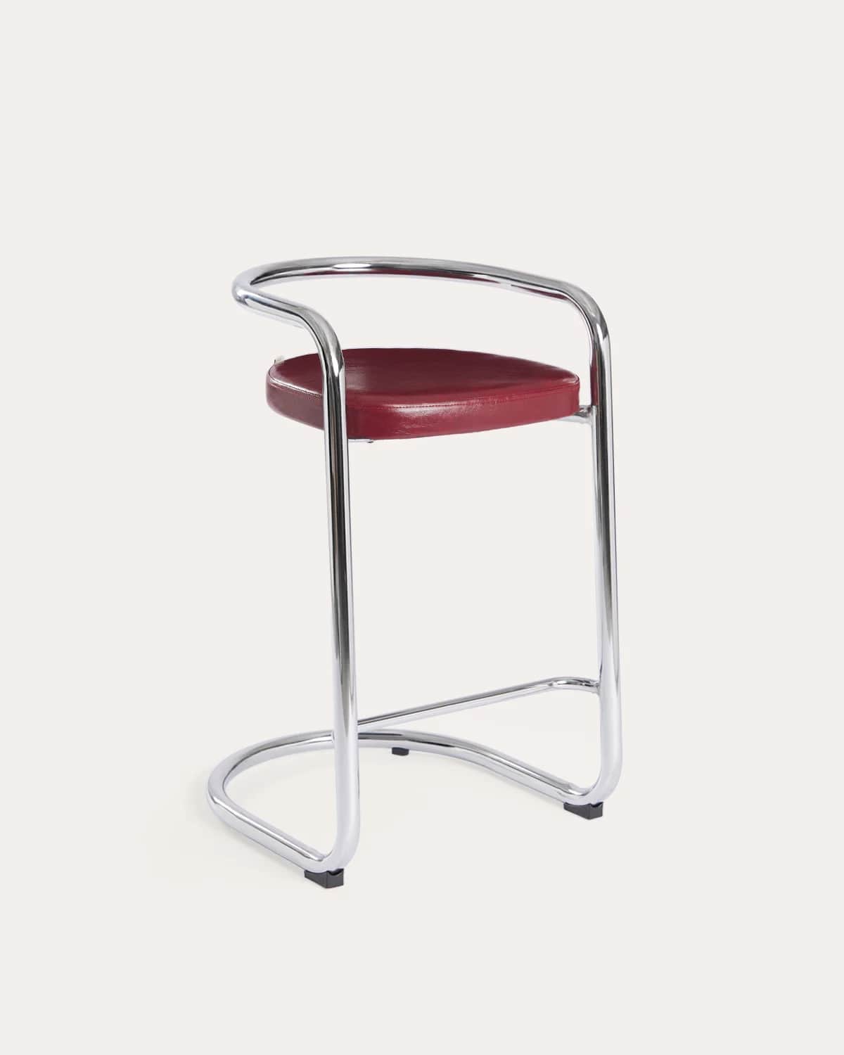 A high bar stool featuring a gleaming tubular chrome frame and a curved, red upholstered seat and ba… — 3D model
