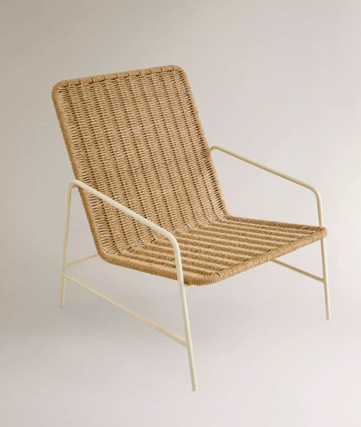 A lounge chair featuring a natural woven rattan seat and back, supported by a slender, light-colored… — free OBJ 3D model