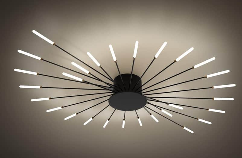 A contemporary Sputnik-style chandelier featuring a central black matte base from which numerous sle… — 3D model