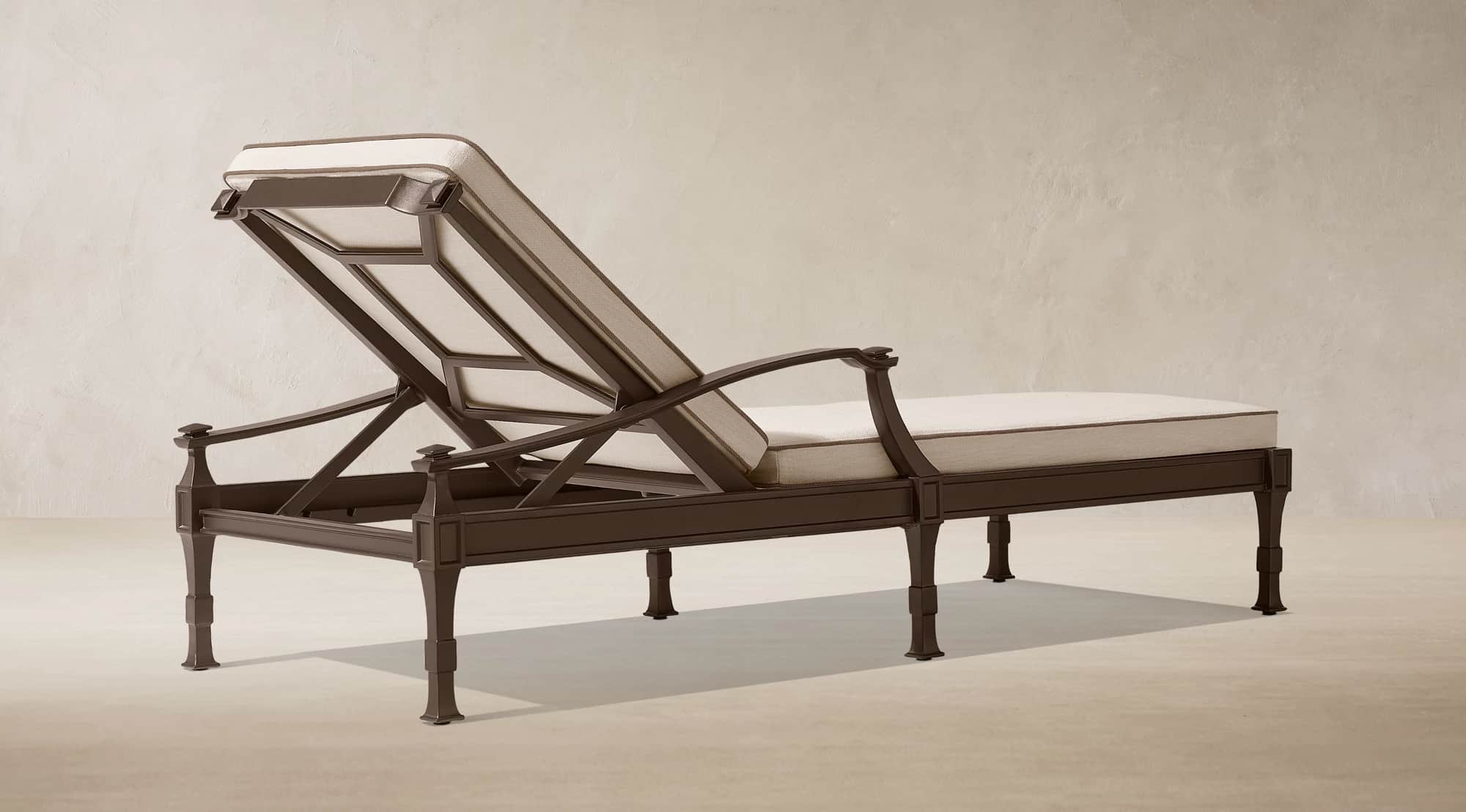 A dark bronze finished metal chaise lounge designed for outdoor use, featuring an adjustable backres… — 3D model