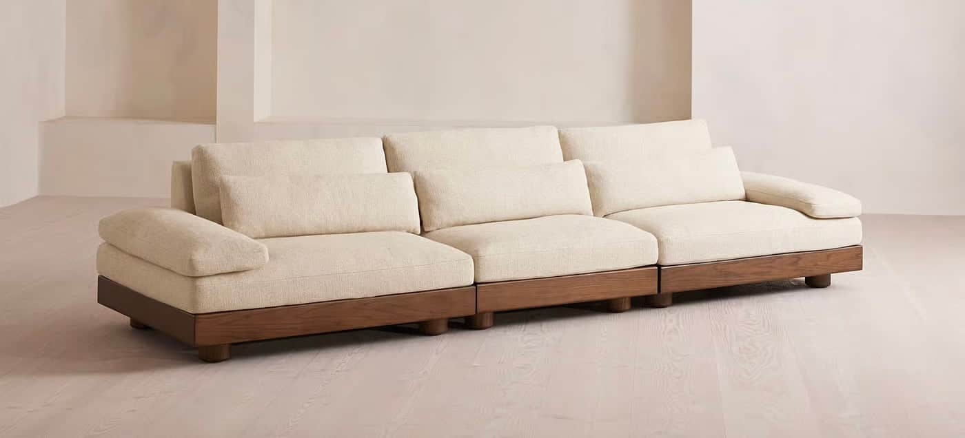 A sectional sofa with three distinct seating modules. Each module features plush, upholstered cushio… — free GLTF 3D model