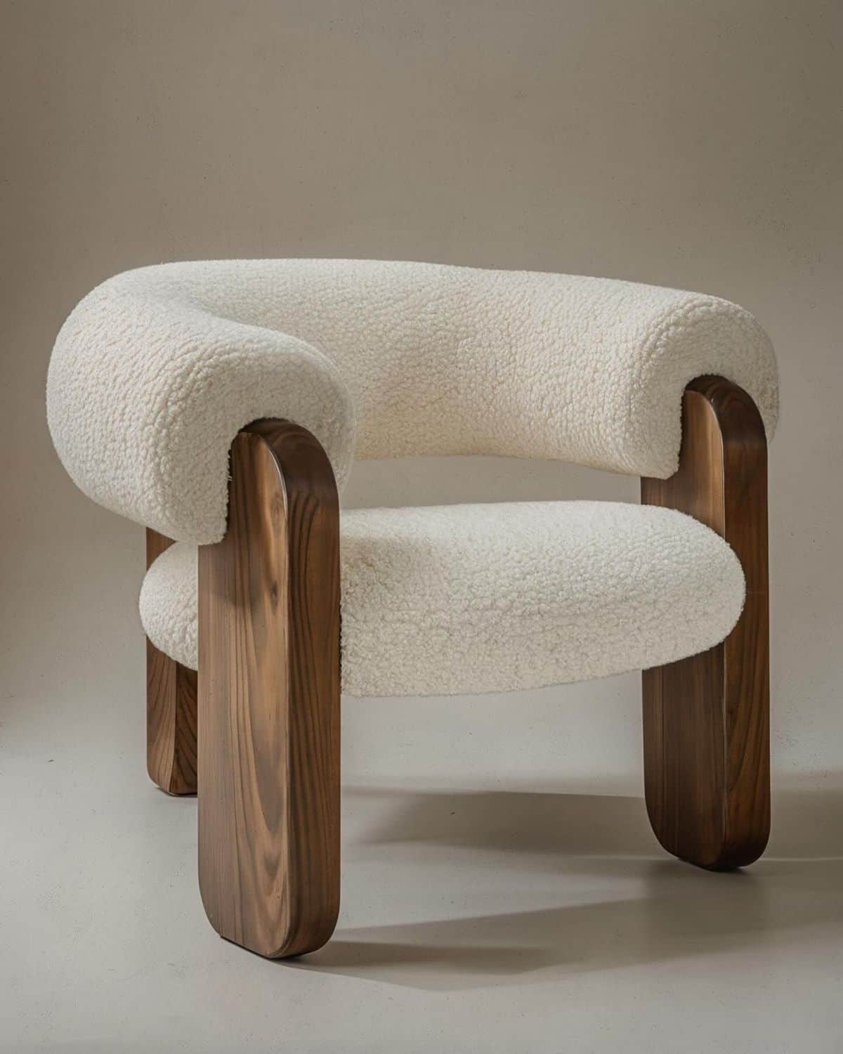 A modern lounge chair featuring a plush, U-shaped white boucle upholstery supported by a dark, round… — 3D model