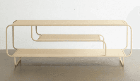 A low, two-tiered shelving unit made from tubular metal with flat shelves, featuring a continuous, b… — 3D model