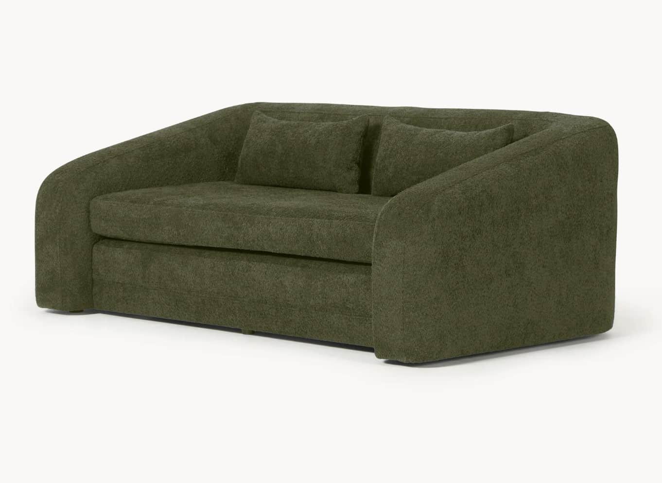 A modern olive-green sofa with a curved design. It features a low profile with rounded armrests and… — 3D model