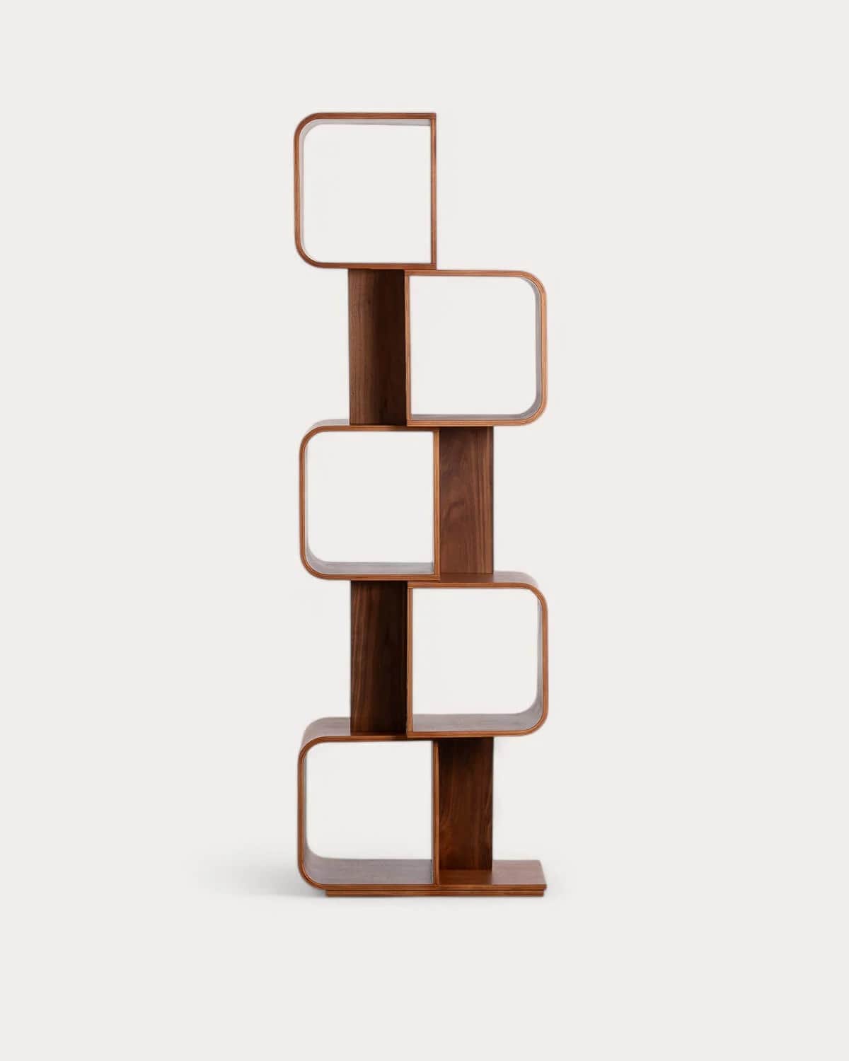 A tall, free-standing bookshelf with a unique, sculptural design. It features curved, open shelving… — 3D model