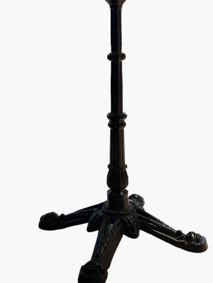An ornate cast iron table base designed for a bistro or cafe table. It features a central fluted col… — 3D model
