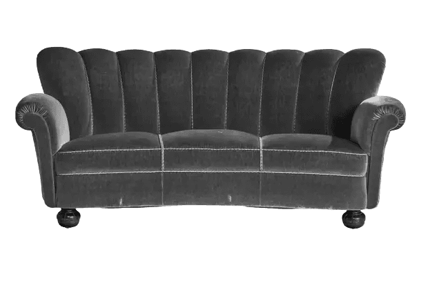 A curved, three-seater sofa upholstered in dark grey velvet. The backrest features a distinctive flu… — free GLTF 3D model