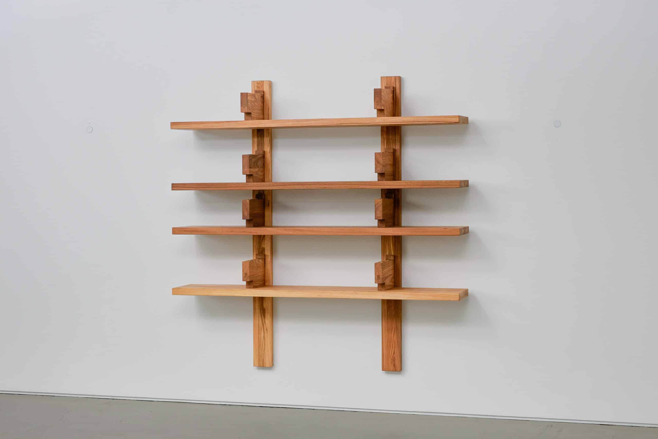 A wall-mounted shelving unit constructed from wood, featuring four horizontal shelves supported by v… — 3D model