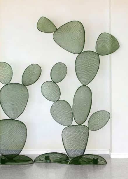 A decorative coat rack designed in the abstract shape of a cactus. It features multiple flat, oval-s… — free OBJ 3D model