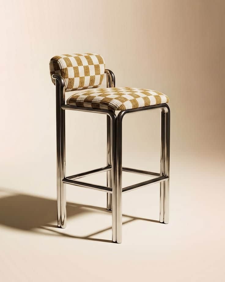 A modern bar stool featuring a sleek, tubular chrome frame and a distinctive checkered upholstered s… — 3D model
