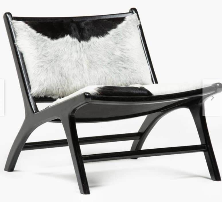 An armless lounge chair featuring a low-slung black wooden frame and upholstery made from genuine bl… — 3D model