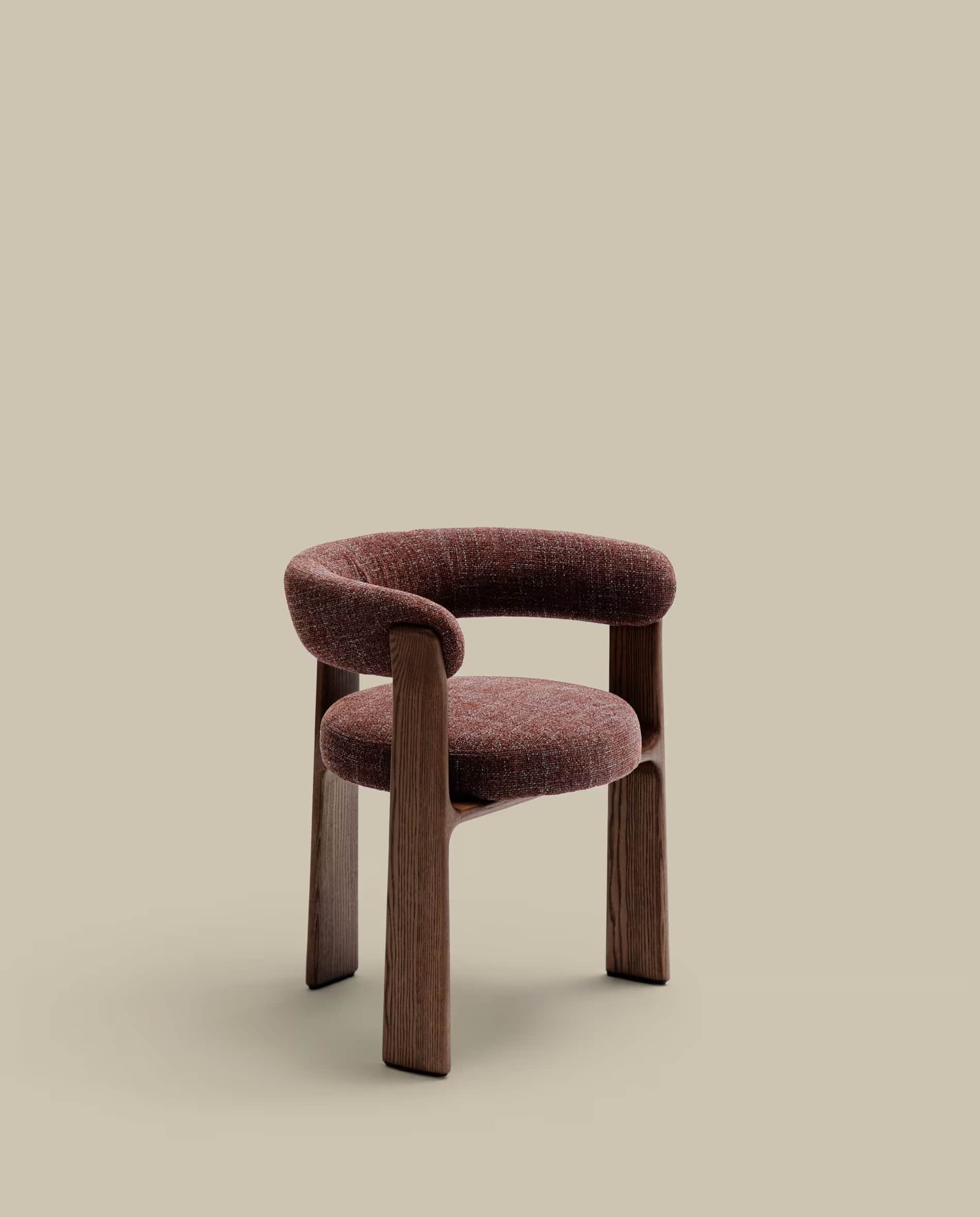 A contemporary dining chair featuring a unique barrel-shaped backrest and seat, fully upholstered in… — 3D model