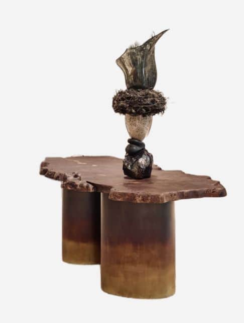A coffee table with a live-edge, irregular-shaped wooden top supported by two cylindrical, gradient-… — free FBX 3D model