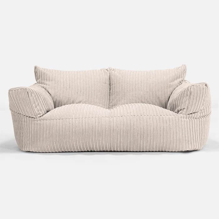 A two-seater sofa with a relaxed, beanbag-like construction. The upholstery features prominent verti… — free GLTF 3D model