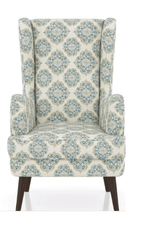 A high-backed wingback armchair upholstered in a patterned fabric featuring an ornate medallion desi… — 3D model