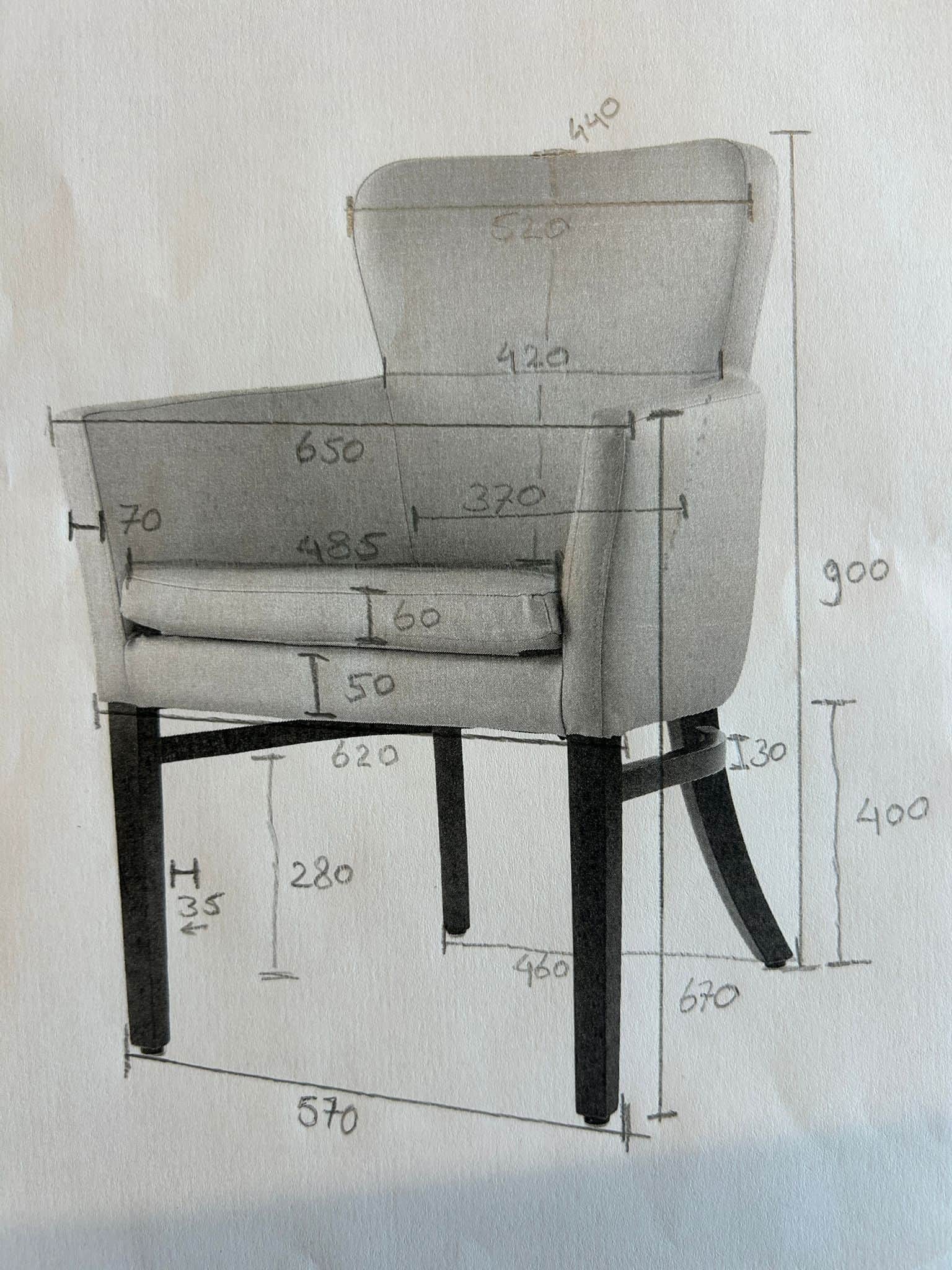 A detailed drawing of an upholstered armchair with various dimensions indicated. The chair features… — 3D model