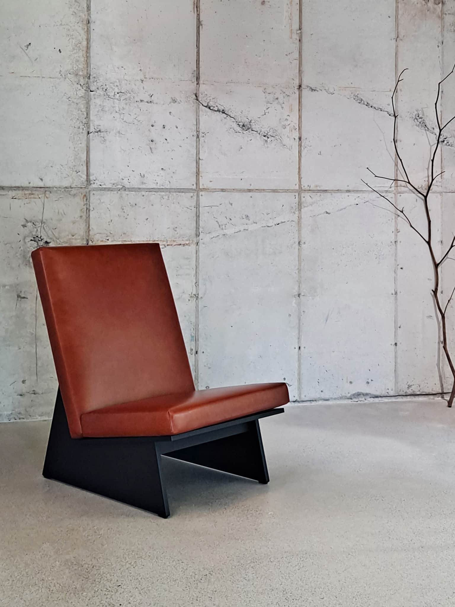 An armless lounge chair featuring a low-profile, angular design. The frame is constructed from black… — free OBJ 3D model
