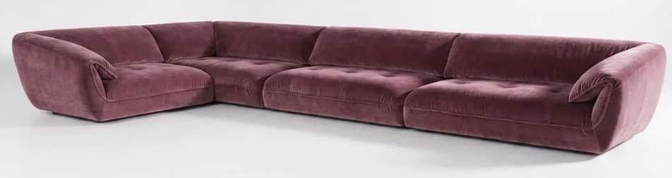 An L-shaped modular sectional sofa upholstered in a plush, mauve-colored velvet fabric. The sofa fea… — 3D model