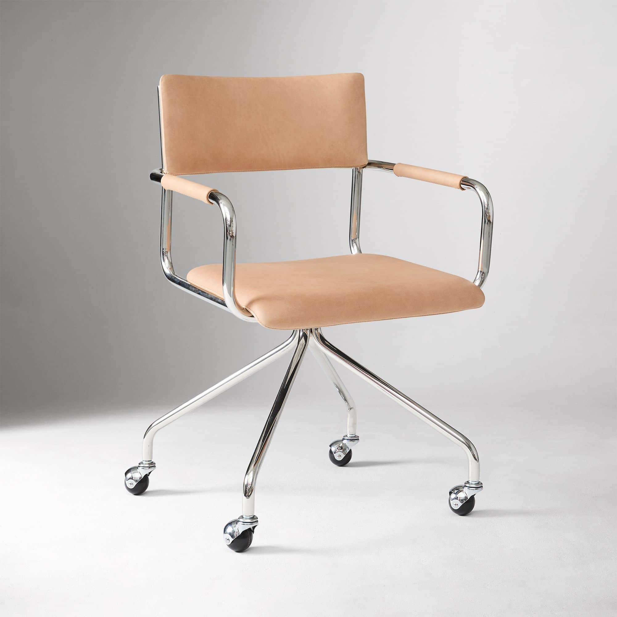A modern desk chair featuring a polished tubular chrome frame, a natural tan leather upholstered sea… — 3D model