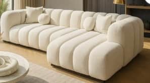 An off-white or cream-colored modular sectional sofa featuring distinctive channel tufting across al… — free SKP 3D model