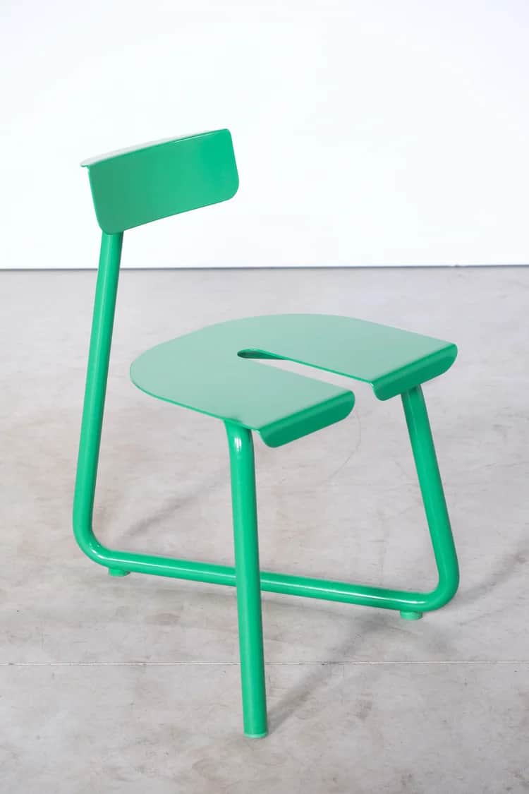 A bright green contemporary chair featuring a minimalist design. It has a distinctive U-shaped seat… — 3D model