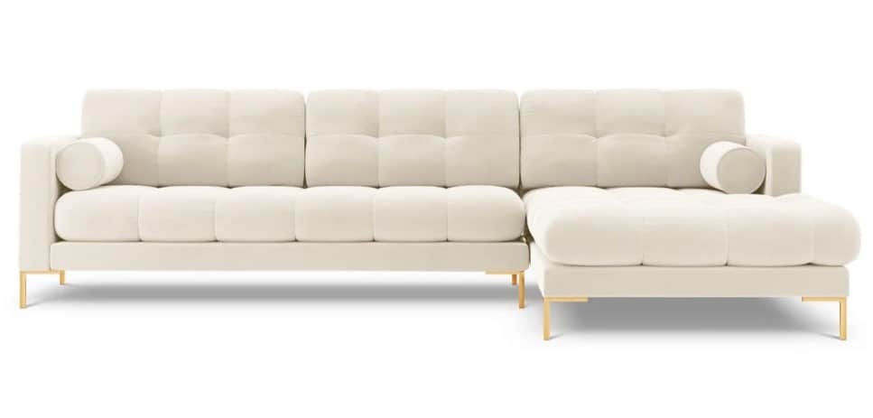 An L-shaped modern sectional sofa upholstered in a cream or off-white fabric, featuring deep button… — 3D model