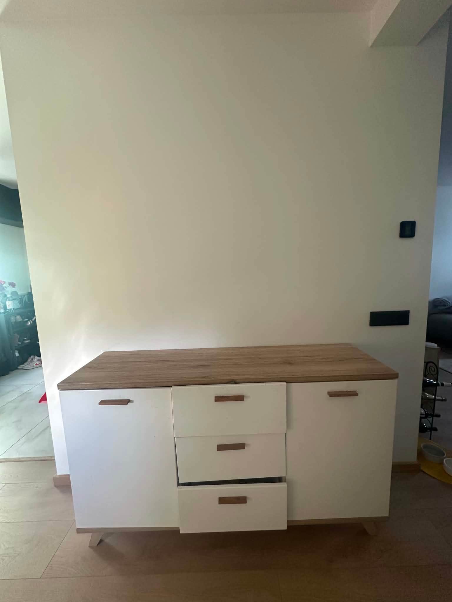 A modern, two-tone sideboard featuring a light wood grain top surface and matching base frame, contr… — 3D model