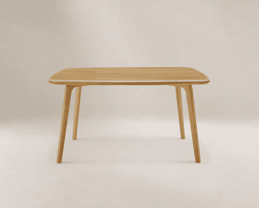 A modern, light-toned solid wood dining table featuring a rectangular top with rounded corners and f… — free GLTF 3D model