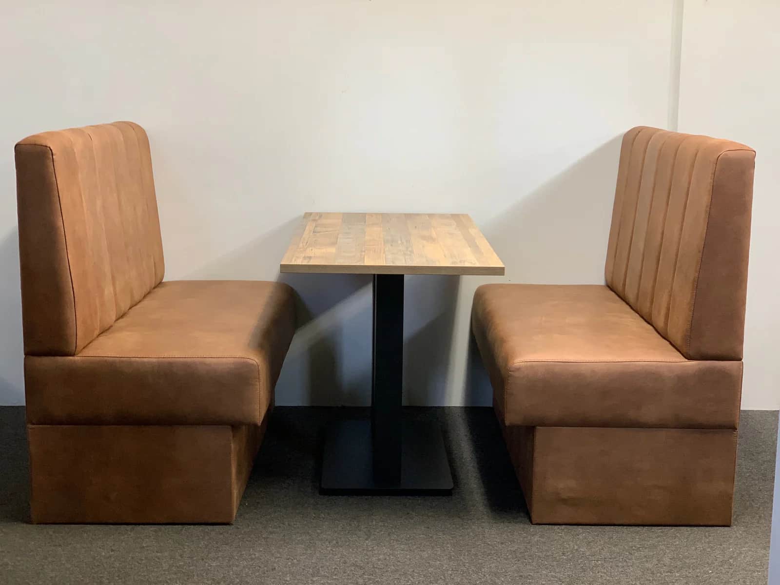 A set of two booth seats with a central table. The booth seats are upholstered in a brown, textured… — free STL 3D model