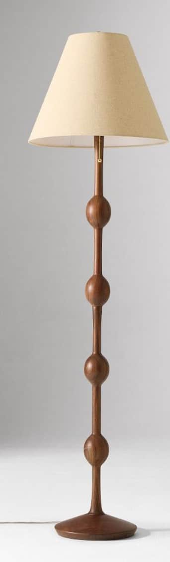 A tall, sculptural floor lamp featuring a dark wood stem with several interspersed spherical turning… — 3D model