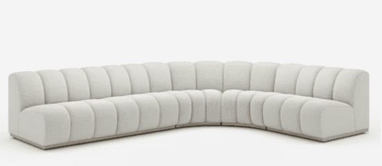 A large, modern, curved modular sectional sofa featuring distinctive channel tufting across its back… — free BLEND 3D model