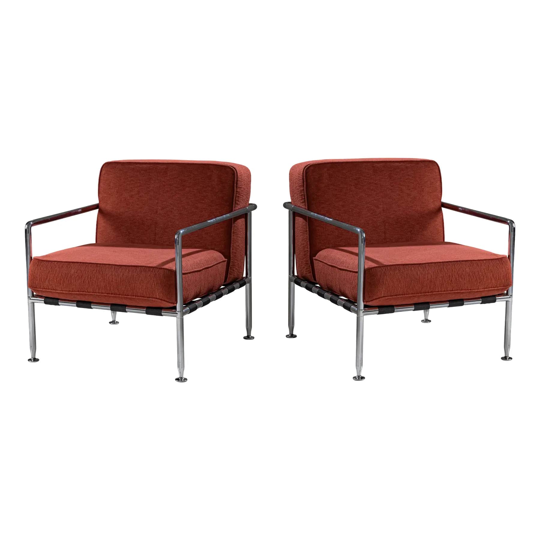 A pair of armchairs with a modern design. Each chair features a polished chrome frame, including the… — free OBJ 3D model